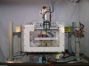 Modified 3D tissue printer sits outside of a biosafety cabinet. Printers like these help researchers to create transplantable bio-artificial organs. (Alonzo Cook)