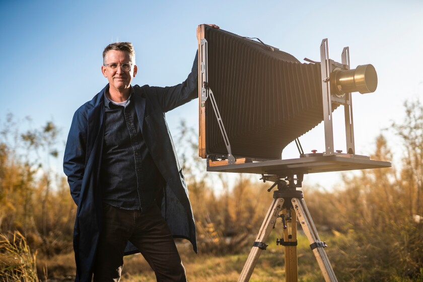 BYU professor Paul Adams poses with tintype camera.jpg