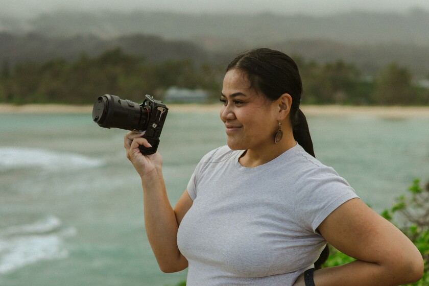 Rosalind Pedron smiles with her camera