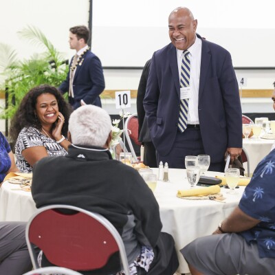 guests smiling at a dinner table