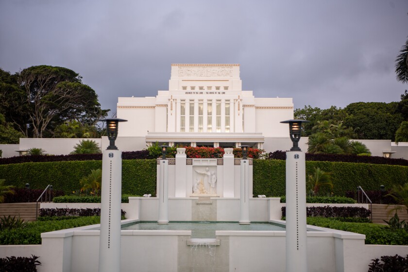 landscape middle shot of the Laie Temple, pool, and surrounding greenery