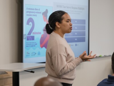 Female student presenting her research.