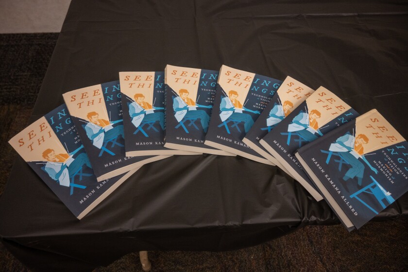 A photo of books spread on the table.