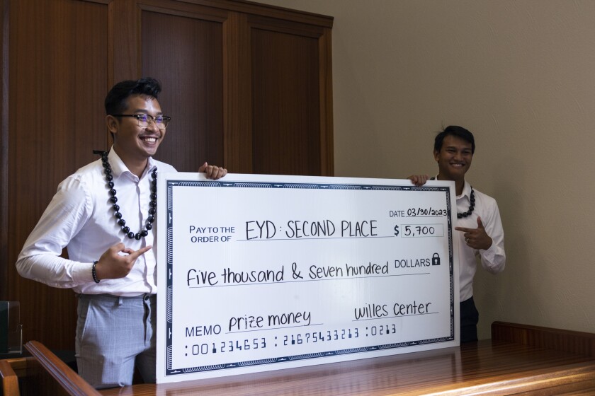 Timothy Putra Samad and Giovanni Reinaldo Boenari with their prize from winning second place at the 2023 Empower Your Dreams competition at BYU–Hawaii.