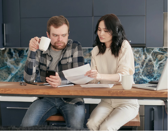 man and woman looking at paperwork