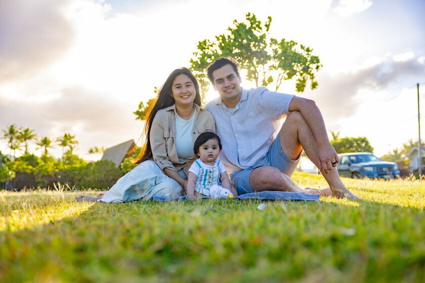 The Hootinis pose for a family picture on a sunny afternoon in Laie