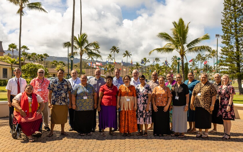 Attendees of the Pacific Church School's Principal's Conference 2023 standing outside the Flag Circle at BYUH.