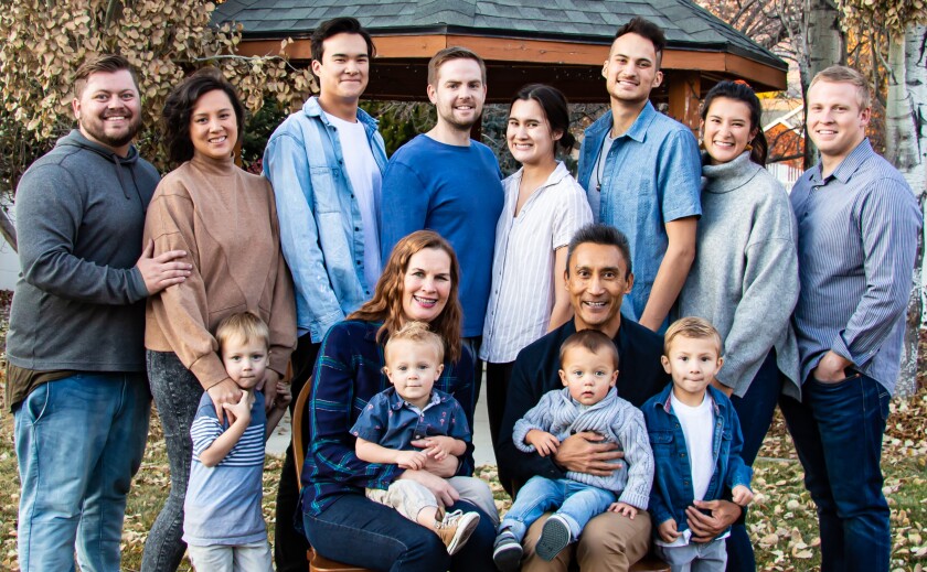 Benoy Tamang's family consisting of 10 adults and four small children.