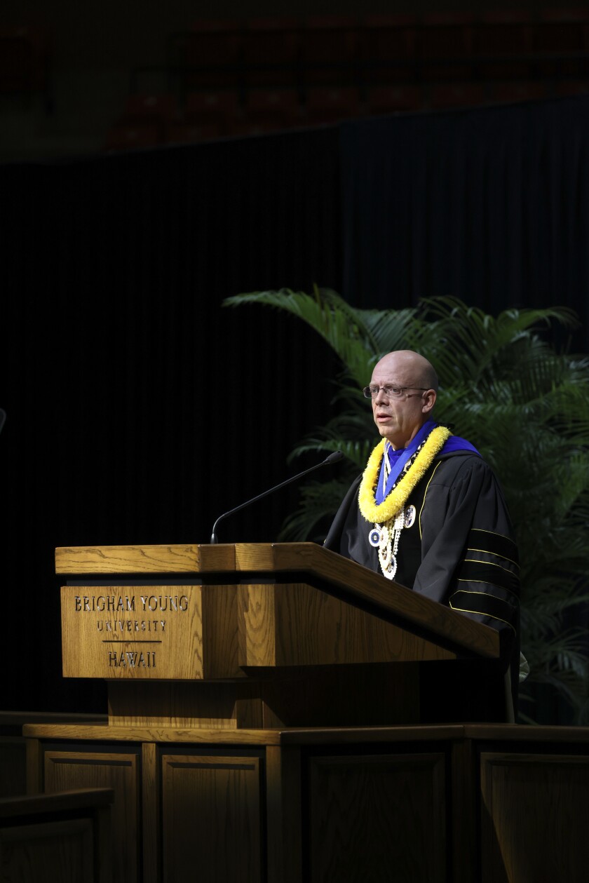 Matthew Bowen talking at podium.