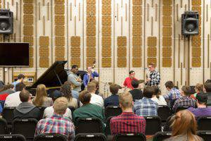 Marcus Printup listens to BYU student Steven Hardy perform. Photo by Max Atwood.