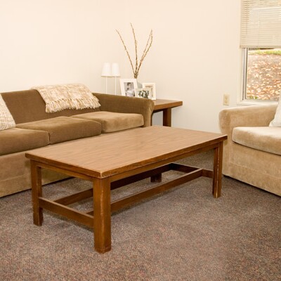 Living room at Wymount Terrace, featuring two couches and a small table.