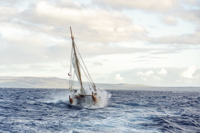 Shimose’s favorite photo of Iosepa smashing through the waves.