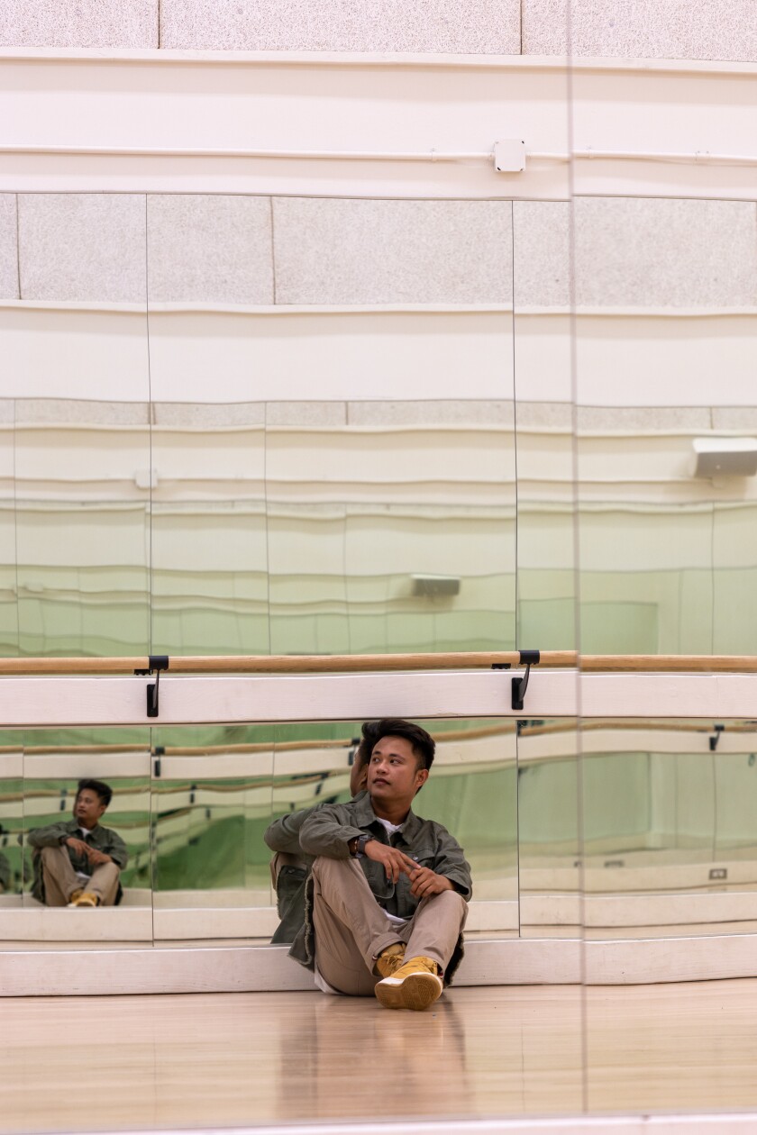 Ryan James Escabarte leaning back in mirror