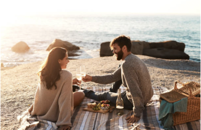 couple eating on the beach