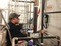 Central Heating Plant technician testing equipment.