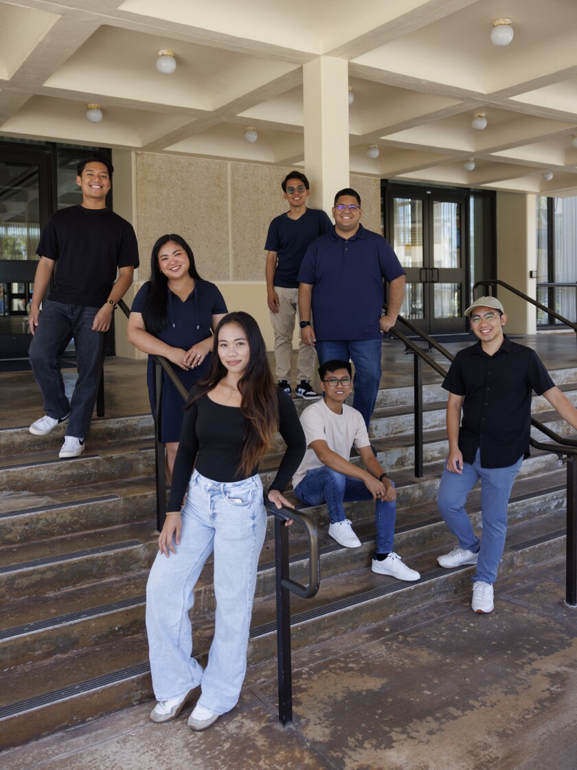 Students standing together on the steps of the Aloha Ballroom.