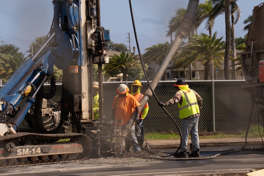Construction workers working on a site.