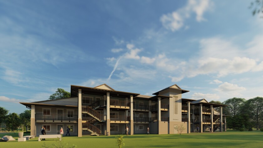 Front view of a new Temple View Apartment. The building is three-stories high with multiple staircases.