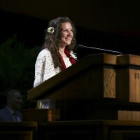 Sister Haylie Chase speaking at the pulpit at BYUH