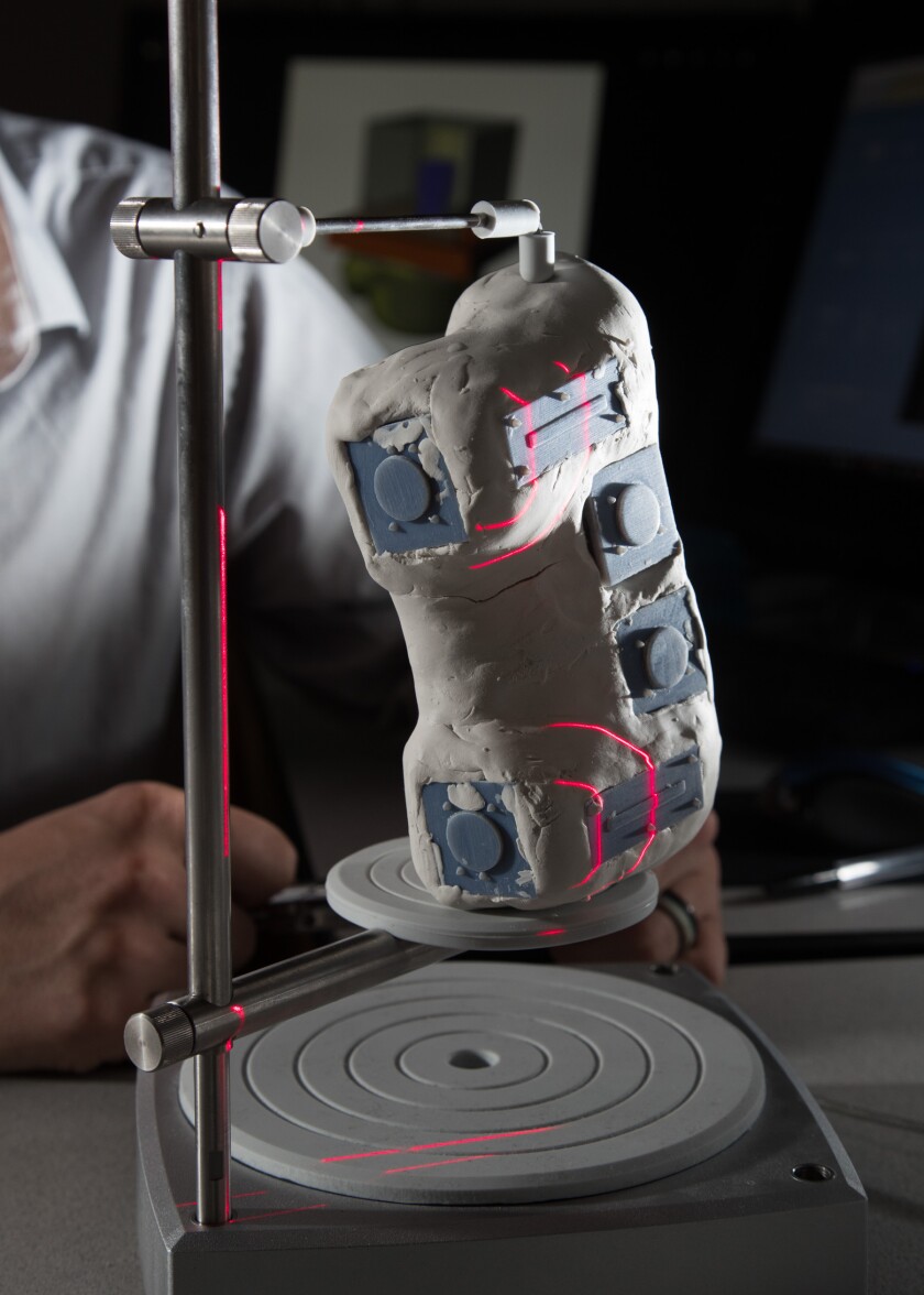 A computer scans the model before printing