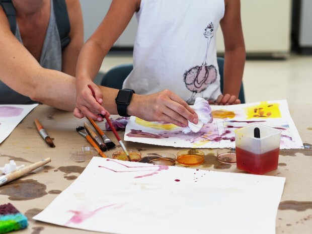 Child and parent painting in mesa