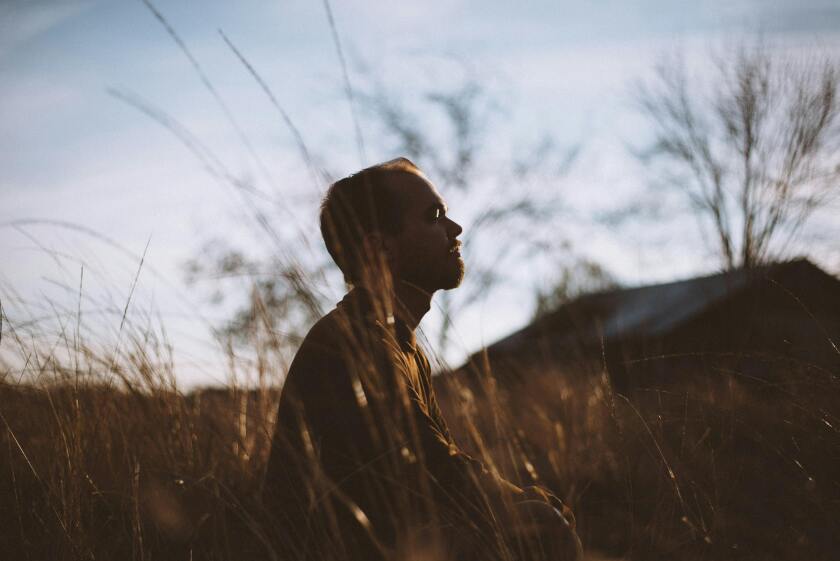 man sitting in nature