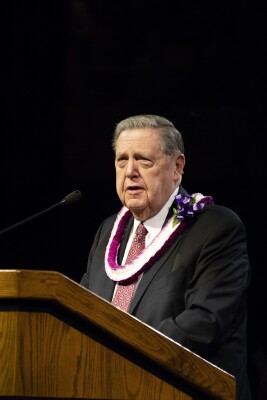 Elder Holland speaking at the Kauwe's inauguration