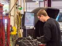 Auto Shop technician running a vehicle diagnosis.