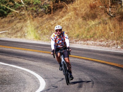 Picture of professor Cox finishing a bike race, for featured the article.