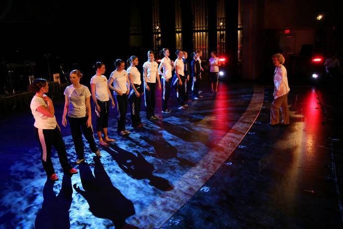Prior to the performance, the folk dancers block one of their numbers.