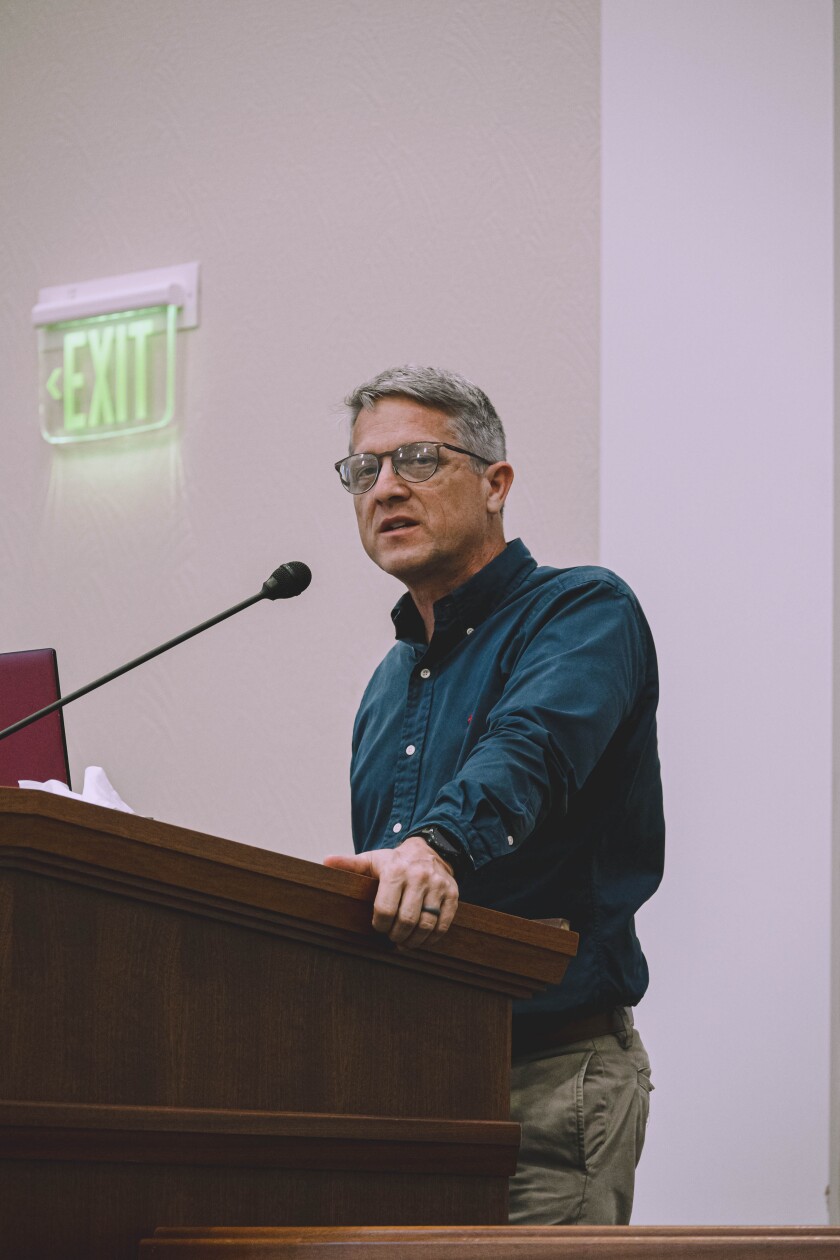 A guy with eyeglasses speaking.