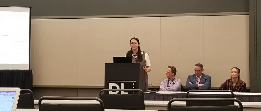 Photo of Leanne Chun presenting with Grant Eckstein, Jacob Rawlins, and Lizzy Hanks at a conference.
