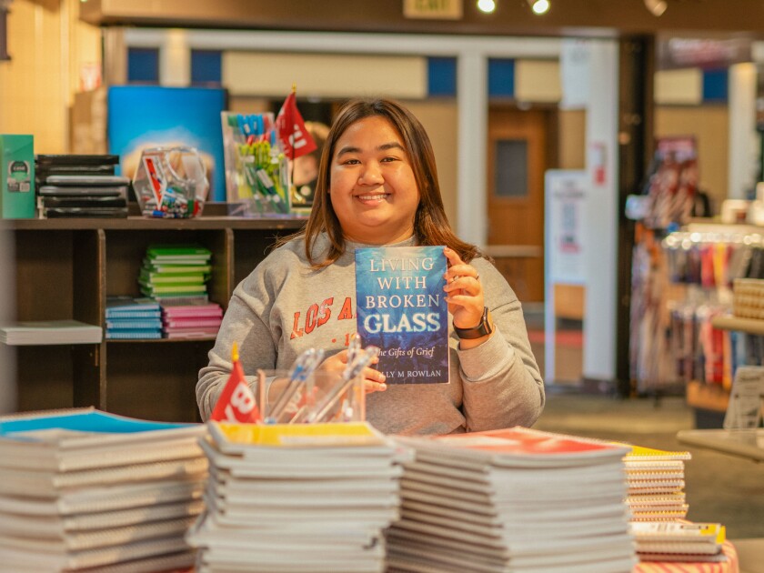 Kantima Romyasai poses holding up a book while in
the BYUH Store