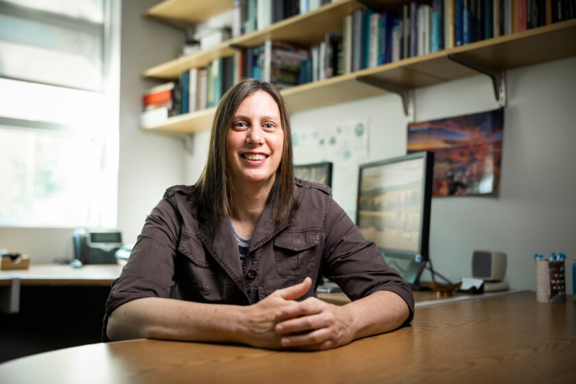 BYU professor Rickelle Richards sits at her desk in her office.
