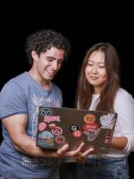 Man and woman looking at laptop together