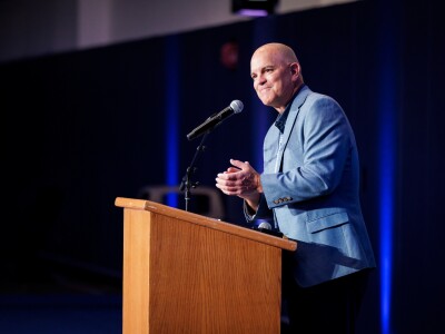 Brian Santiago speaks at podium