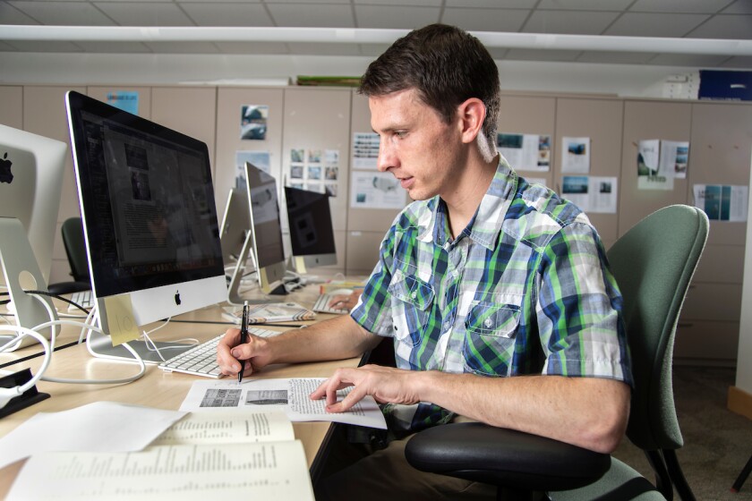 student at computer desk