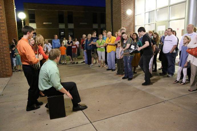 Prior to the performance, the band entertains the line while they wait for the doors to open.