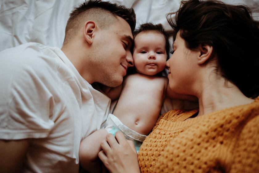 mom and dad with a baby