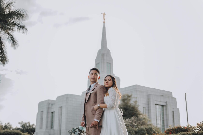 Morian and Carrah Louise Labis standing in front of the Cebu City Philippines LDS temple.