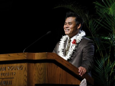 Ban Phung at a podium