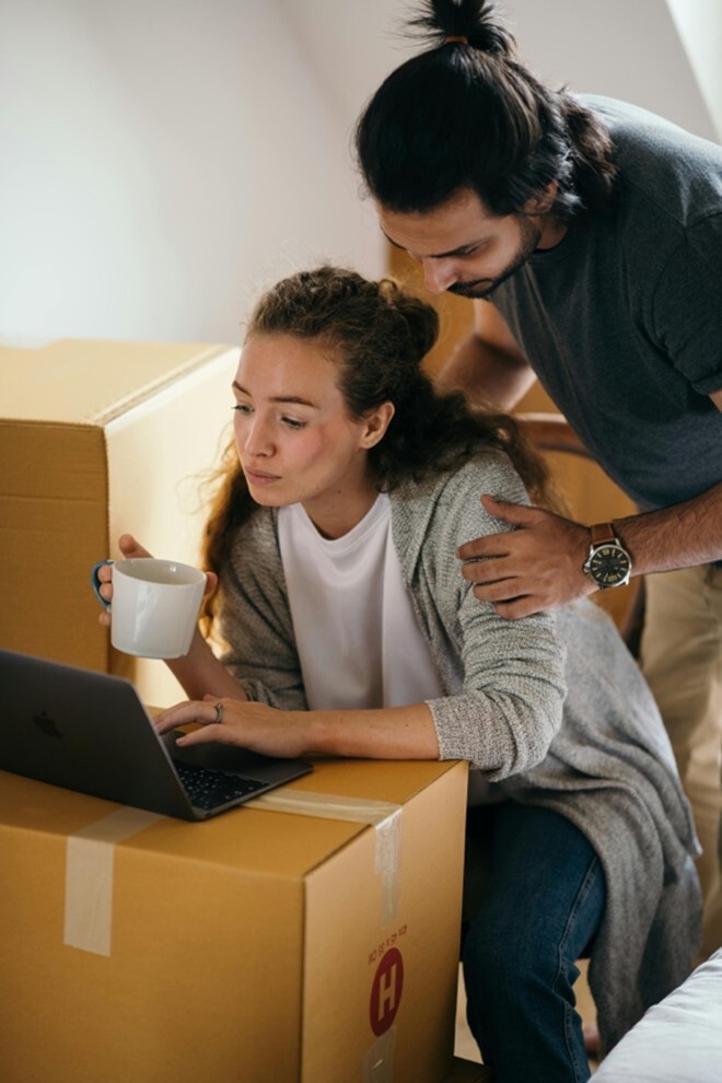 A couple looking at a computer